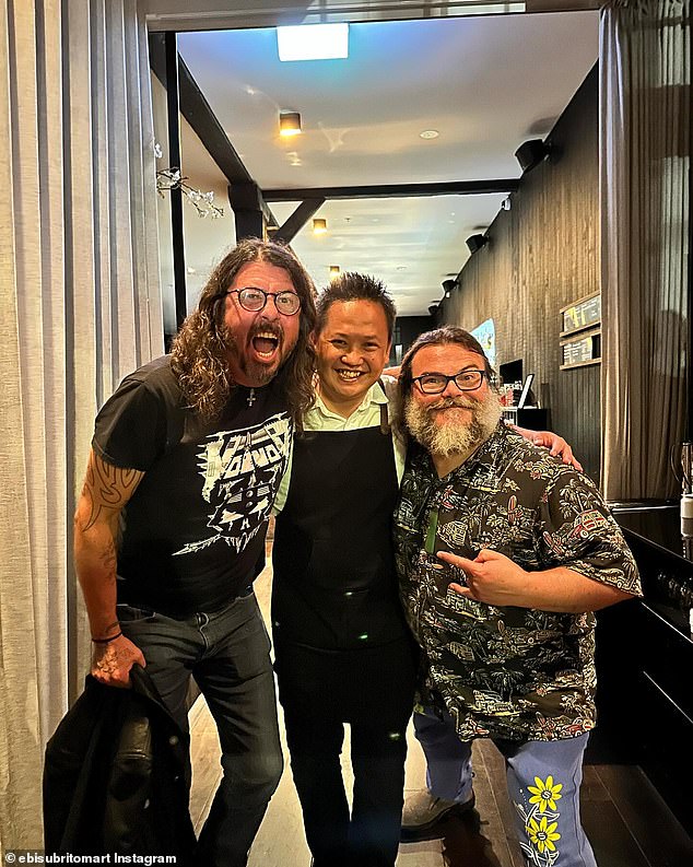 While hanging out with Foo Fighters singer Dave Grohl, 55, (left), the pair posed for a photo with one of the staff members, which was posted to the restaurant's Instagram