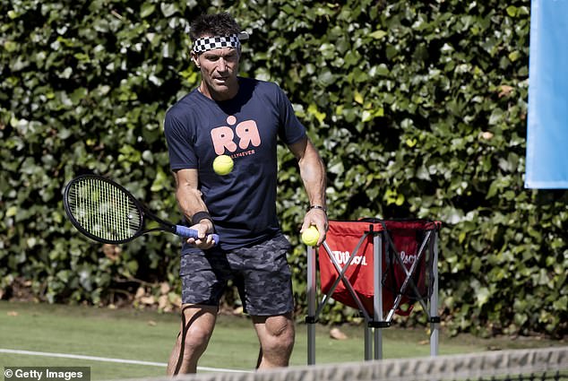 Pat Cash (pictured) appeared to train Ben and Redfoo as he lightly served balls from the other side of the court