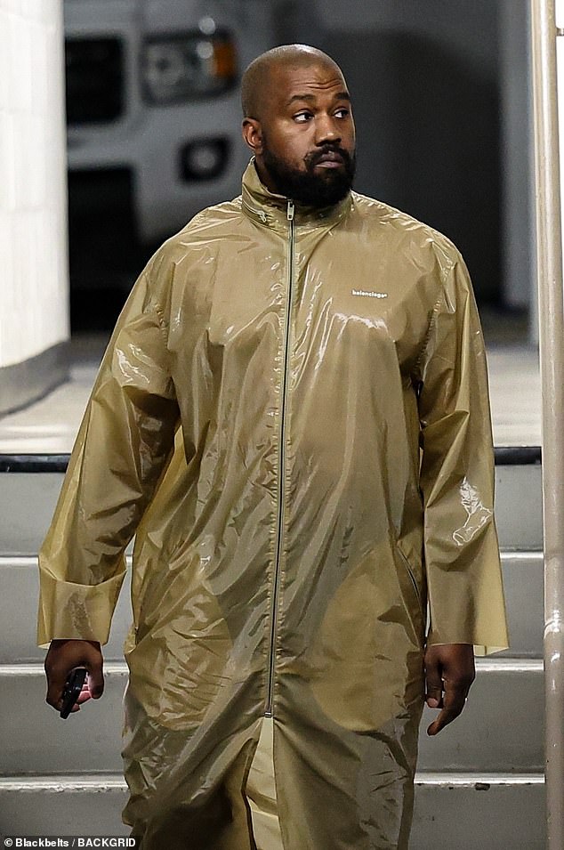 Kanye braved the stormy weather with a Balenciaga jacket