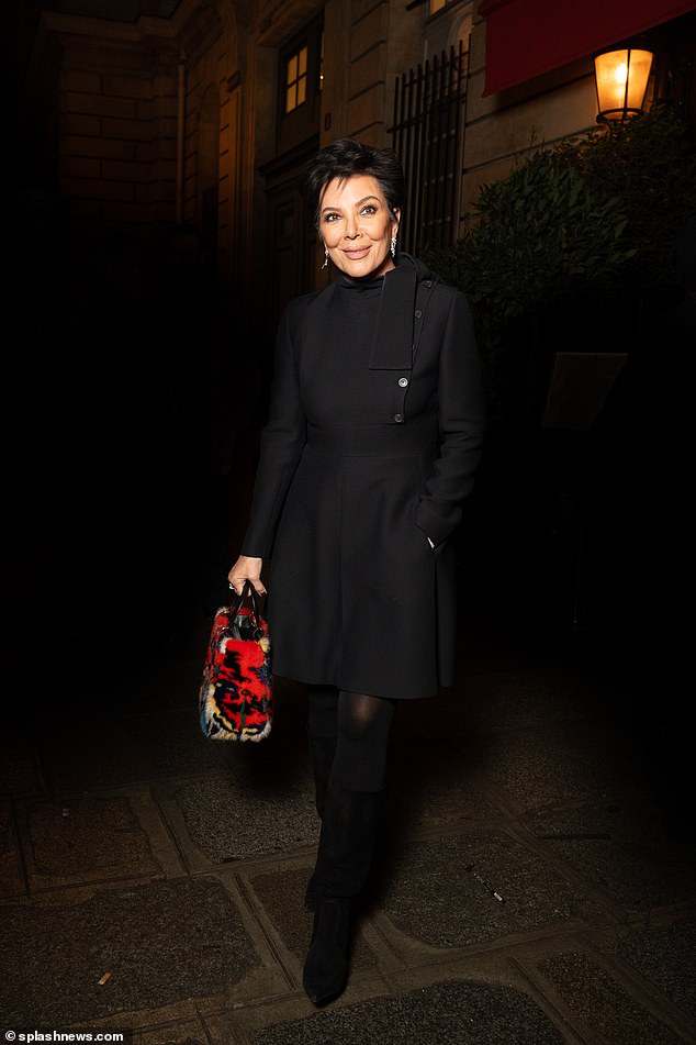 The television personality paired the look with a red patterned handbag, opaque tights and knee-high suede boots