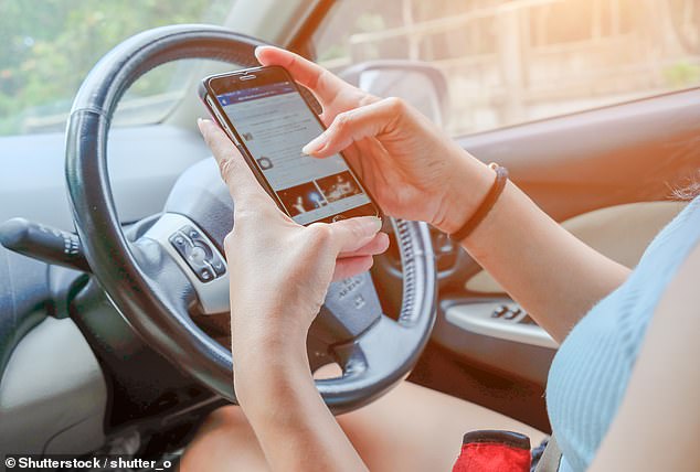 Using a mobile phone while driving (pictured) is one of the offenses that will result in double demerit points over the Australia Day long weekend