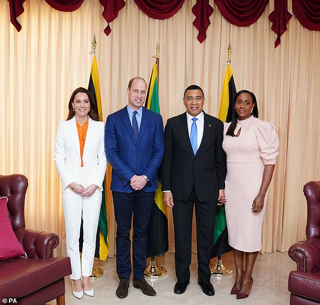 Kate wore a £1,945 Alexander McQueen trouser suit as she and her husband Prince William posed with Andrew Holness and his wife Juliet at Vale Royal, their official residence in Jamaica's capital Kingston, in 2022