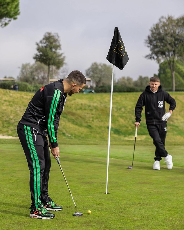 The pair posed for photos on a golf course as Hazard lined up a putt while Morgan stood in the background watching him play a shot.