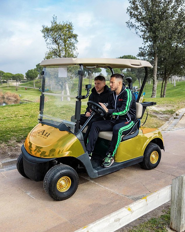 The pair were also pictured driving a gold golf buggy with the brand's logo printed on the hood