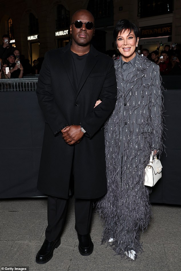 Also in attendance were Kris Jenner and her partner Corey Gamble as the pair posed together as the reality star linked her arm through the businessman's arm.