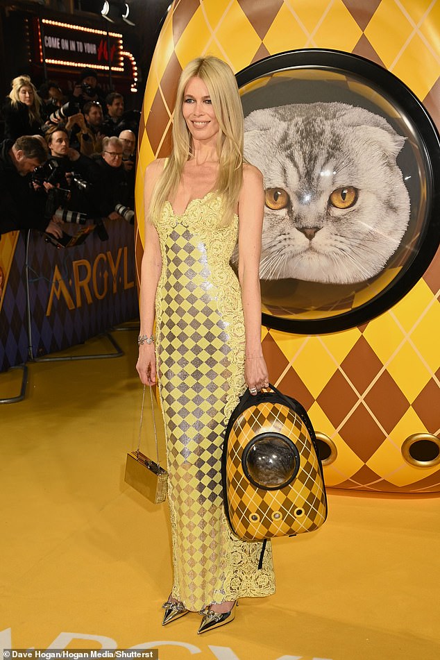 Supermodel Claudia arrived at the premiere in London's Leicester Square with her and Matthew's kitten Chip in a yellow backpack