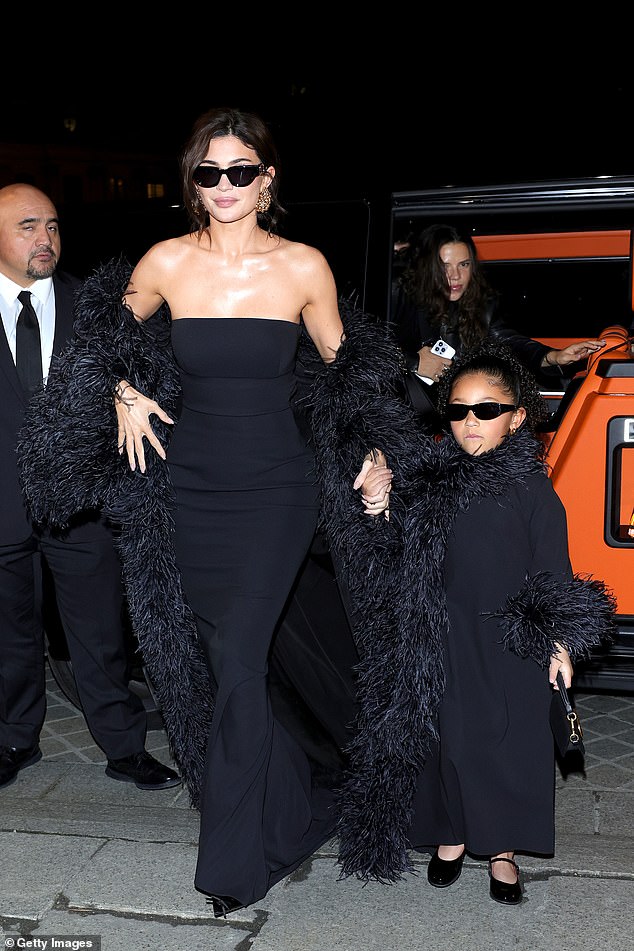 Stormi looked adorable in a long black maxi dress, while she also wore a daddy bow tie and accessorized with a miniature handbag