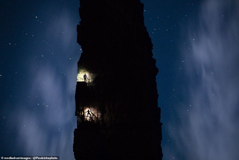 1706130202 35 Mesmerizing images capture daredevil climbers hanging from ice caves and