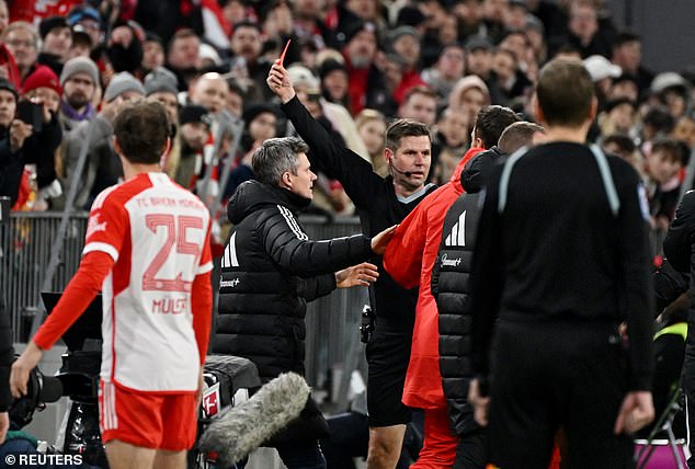 Referee Frank Willenborg shows the Croatian manager the red card for violent behavior