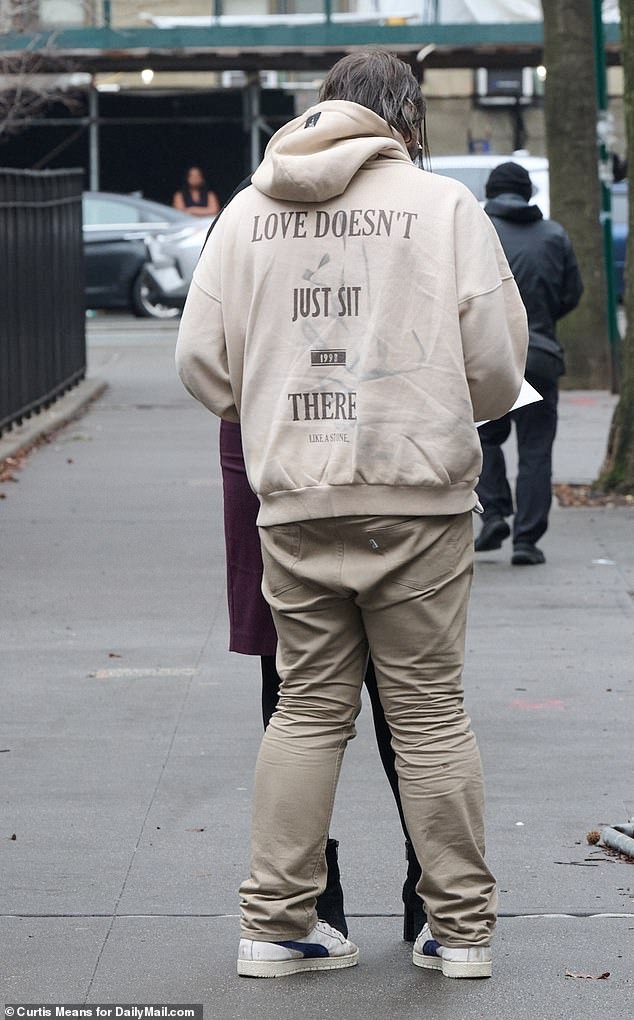 His sweatshirt bore the quote from author Ursula K Le Guin, which reads in full: “Love doesn't just sit there, like a stone, it has to be made, like bread;  made again and again, made new'