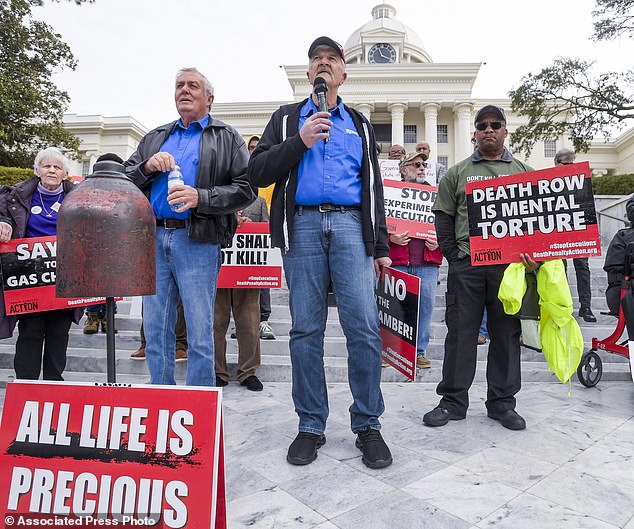 Former death row inmates who were exonerated, from left to right Randall Padgent, Gary Drinkard and Ron Wright, were among nearly a hundred protesters who gathered at the State Capitol building in Montgomery on Tuesday to ask Gov. Kay Ivey to suspend the planned execution of Kenneth Eugene.  Smith