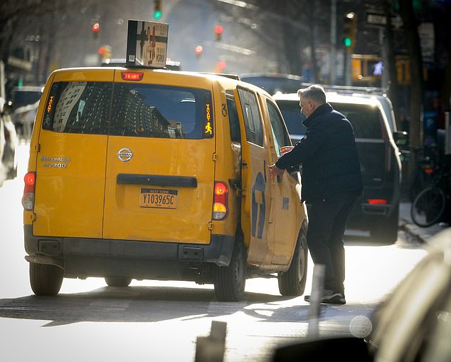 Alec Baldwin returns to his New York City home after trading his SUV twelve blocks from home to take a cab and sneak into a side gate of his building, after his wife tried to be a 'distraction', dressed in spicy clothes during the day