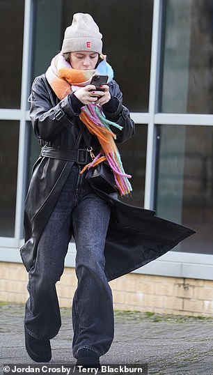 The actress, best known for her role as Faye Windass in Coronation Street, looked concerned as she checked her phone before returning to her hotel