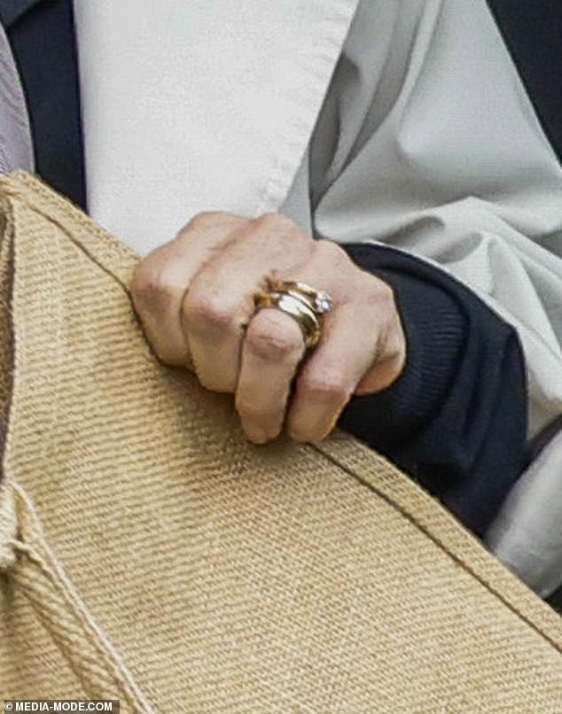 Two rings were seen on her left wedding finger