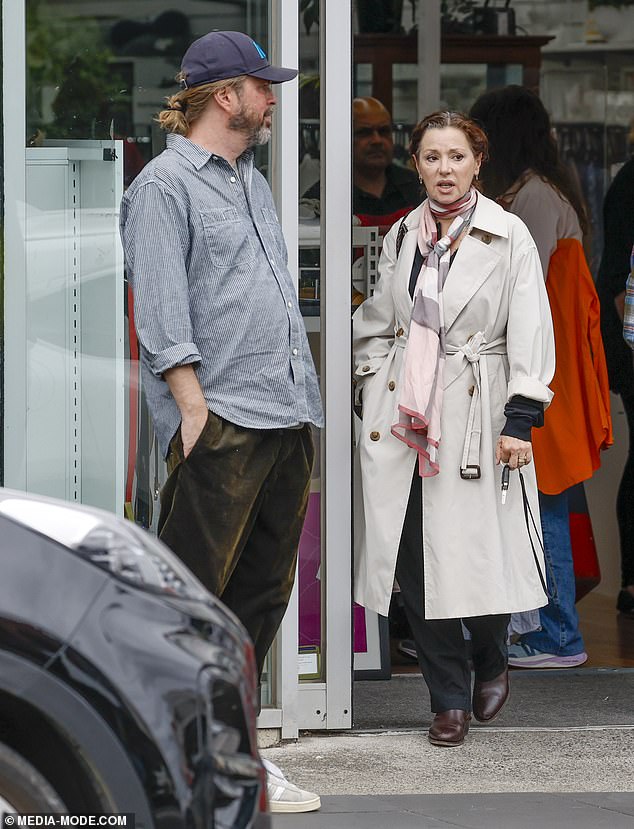 The producer paired his ensemble with a pair of white Adidas sneakers and pulled his hair back into a low bun at the nape of his neck.