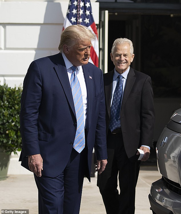 Federal prosecutors are seeking a six-month prison sentence and a $200,000 fine for Peter Navarro, a former Trump trade adviser, both pictured on the South Lawn of the White House on September 28, 2020