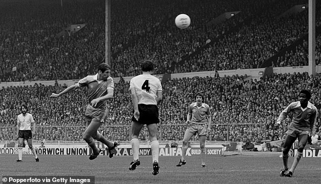 Hutchinson (left) jumps in front of Tottenham defender Graham Roberts to give City the lead