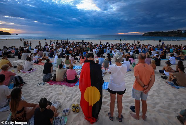 Thousands of Australians greeted the dawn of a scorching hot Australia Day at native beach and park ceremonies across the country (pictured, Bondi Beach on Friday)