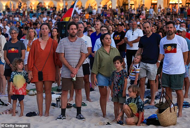 Temperatures in Sydney reached 30 degrees Celsius at 7am as hundreds of people lined Bondi Beach in the eastern suburbs for a solemn Dawn Reflection and Smoking Ceremony (pictured)