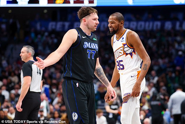 Suns forward Kevin Durant (35) laughs near Mavericks guard Luka Doncic (77) on Wednesday