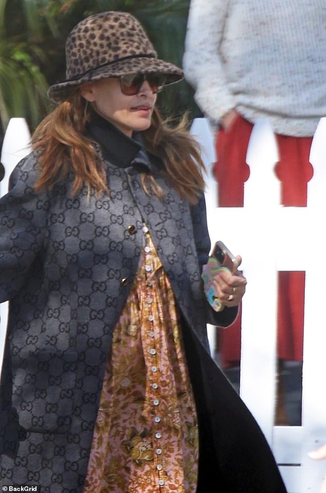 The actress stepped out to run errands in Santa Barbara on Thursday, wearing a stylish gray Gucci coat and a leopard print fedora.