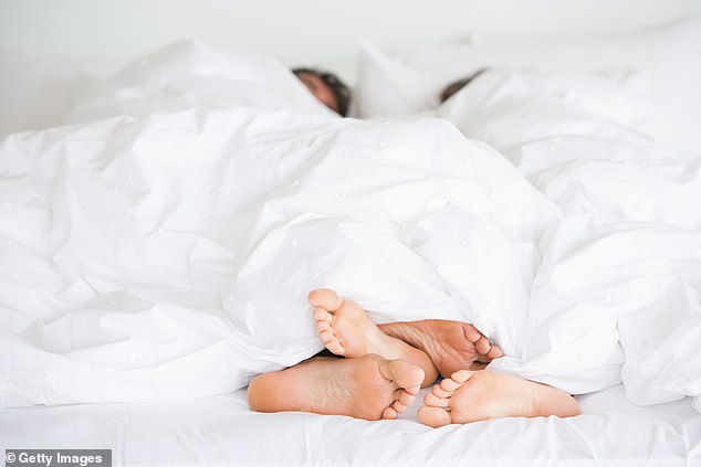 Unintentionally having sex during sleep (sexsomnia) may be related to external factors such as stress and alcohol, according to the Sleep Foundation (stock image)