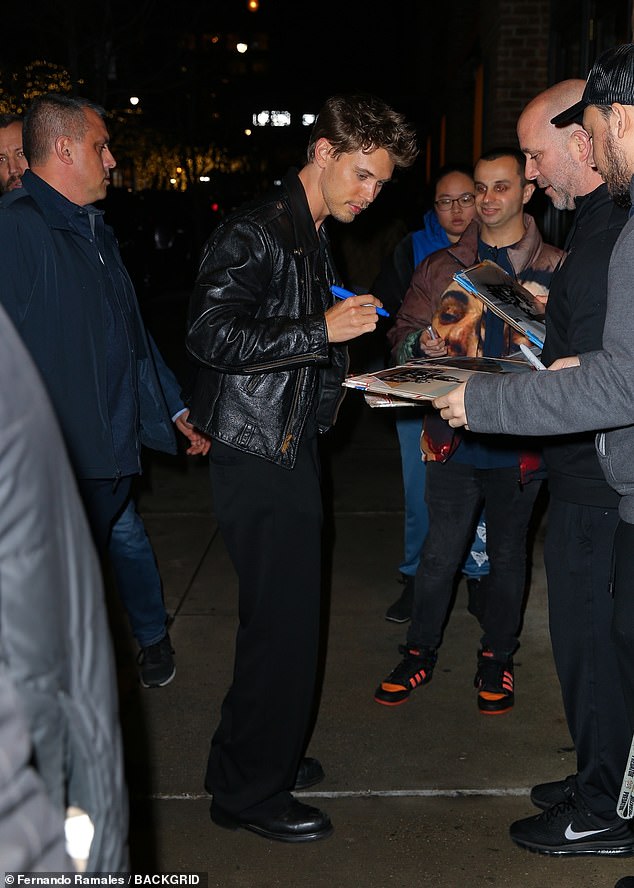 Butler opted for a black leather jacket over a black shirt for the event as he signed autographs for numerous fans