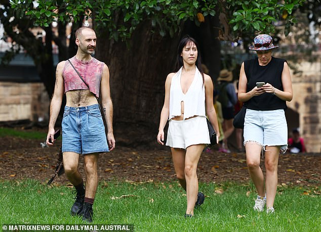 A group of protesters are pictured walking towards the rally in Belmore Park