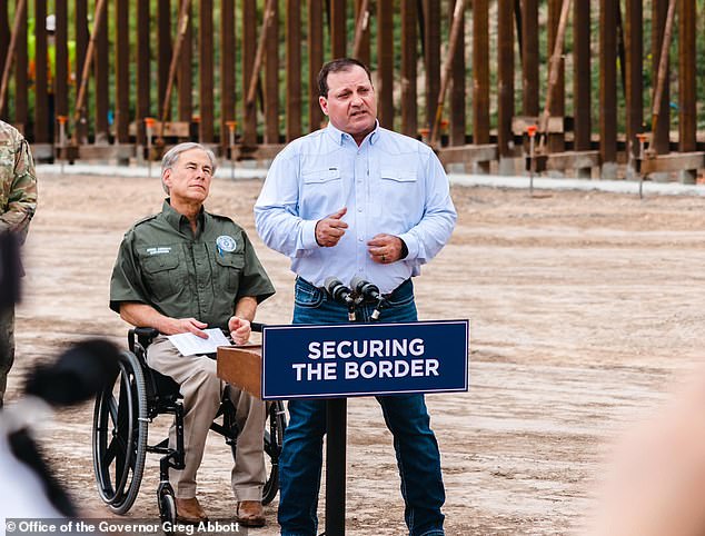 Texas Border Czar Mike Banks (center, with Texas Governor Greg Abbott) told ranchers they could have barbed wire installed on their properties for free