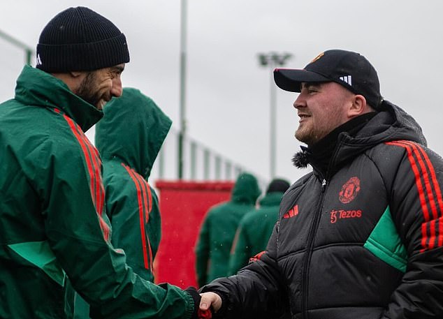 Club captain Bruno Fernandes smiled at Littler as they shook hands with Carrington