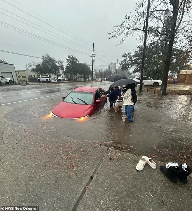 Footage also emerged from New Orleans on Wednesday in Mandeville, Louisiana, showing a vehicle stuck in a large ditch