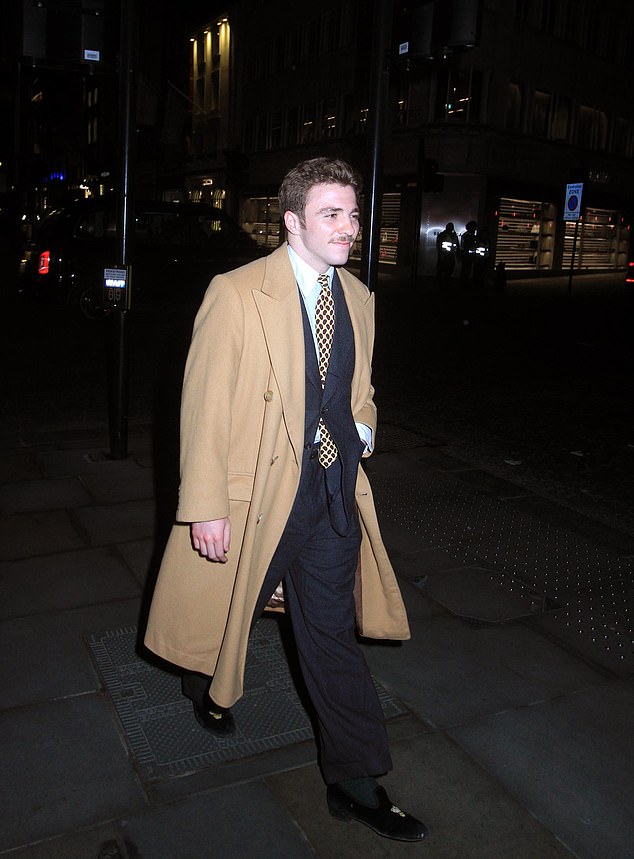 Rocco seemed in good spirits as he walked around London with his friends