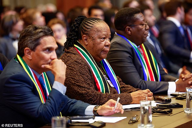 South African officials listen as the International Court of Justice in The Hague rules on their country's case against Israel