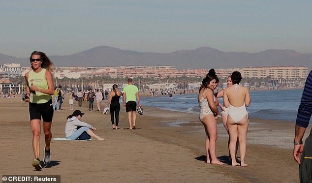 A busy beach when temperatures soared in Spain.  The country also recorded unusually high temperatures in December