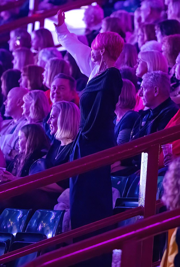 Jackiey later stood up as she clapped and waved wildly on stage after her grandson's performance