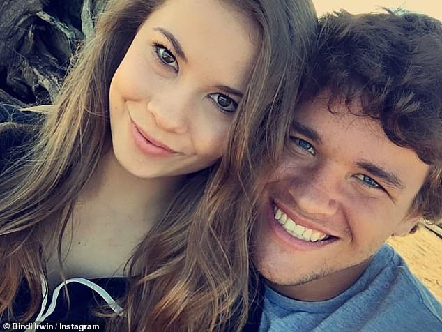 She shared two photos, including a recent one and one taken at the beginning of their relationship, which show the teenage couple in casual clothes as they pose on a beach.