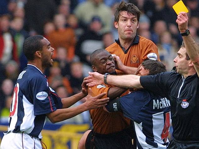 West Brom's Jordao (left) receives a yellow card during the 2001 match between the rivals