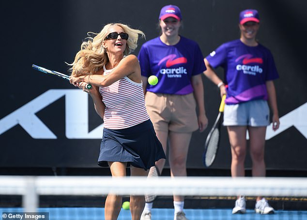 Jackie dressed to impress in a navy blue mini skirt and white and red striped shirt as she worked up a sweat