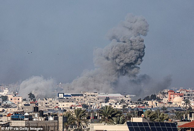 Smoke rises after an Israeli attack in Rafah, in the southern Gaza Strip, on Friday