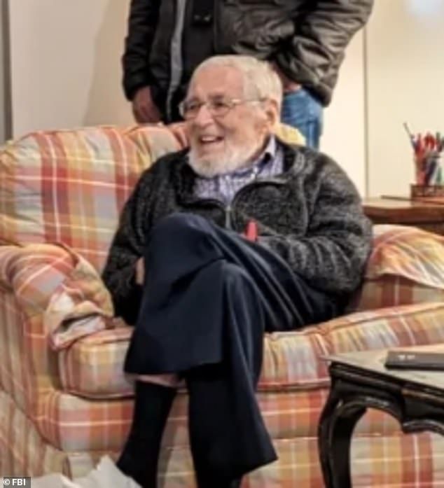 Francis grins as he looks at the artwork stolen from his father's house by three gangsters in July 1969