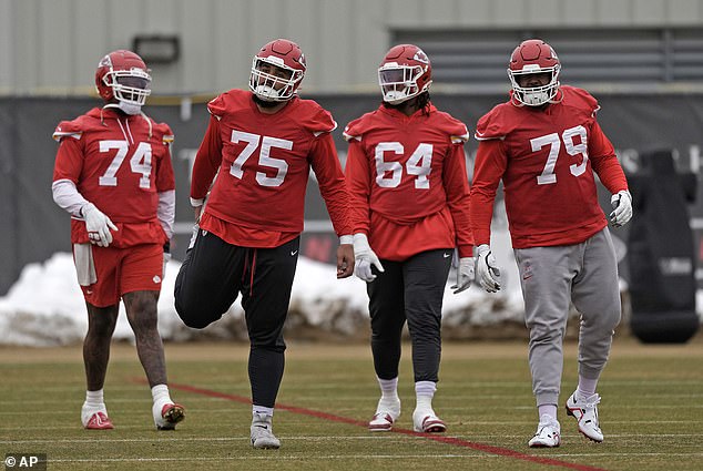 The Chiefs offensive line stretches before practice ahead of the game against the Ravens