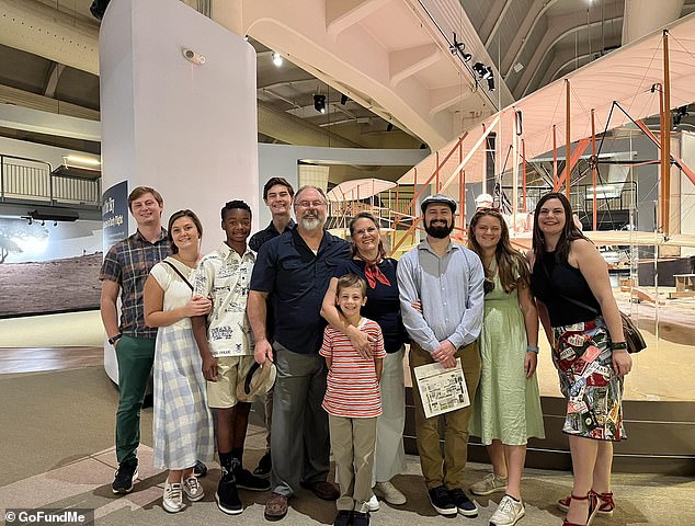 Mark shared a total of eight children with his wife Andrea (center).  Two of the eight were adopted