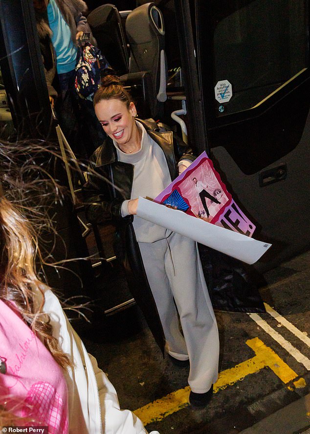 The actress donned a black leather jacket to complete her look, with her eyeshadow popping bright pink after the glamorous show