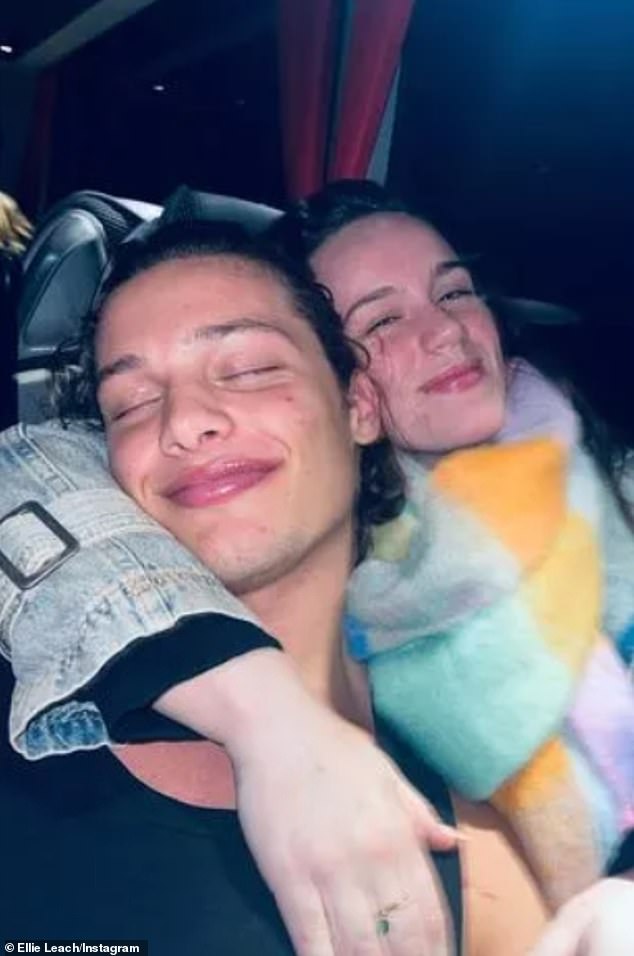 On Tuesday evening, Ellie (wearing her scarf) shared a selfie on Instagram as she cuddled up to Bobby while on her way from Birmingham to Sheffield.