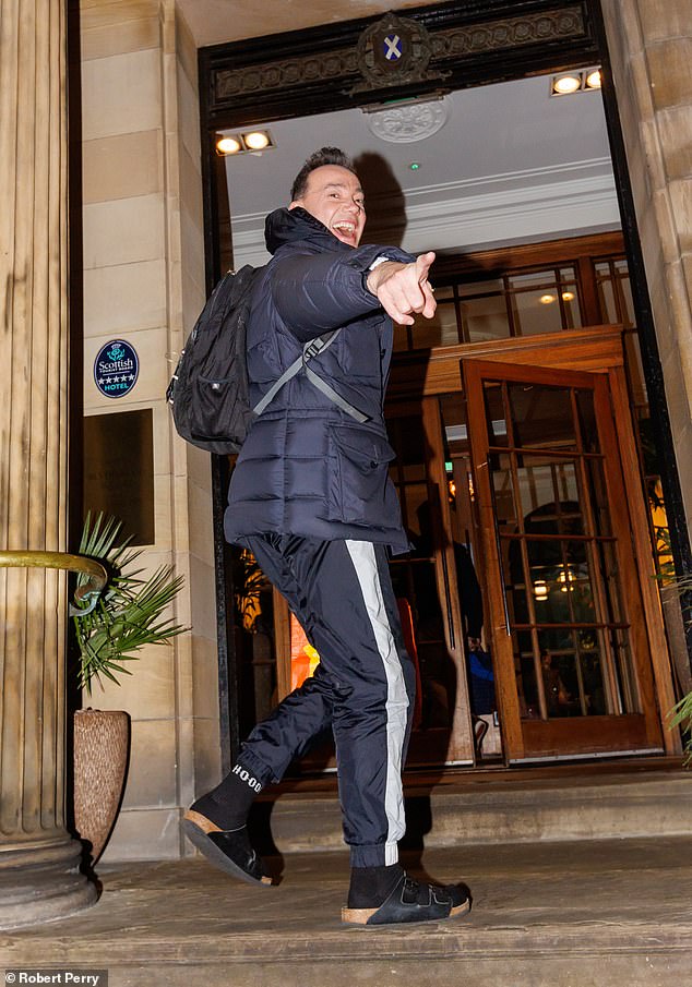 Craig Revel Horwood smiled as he entered the Blythswood Hotel