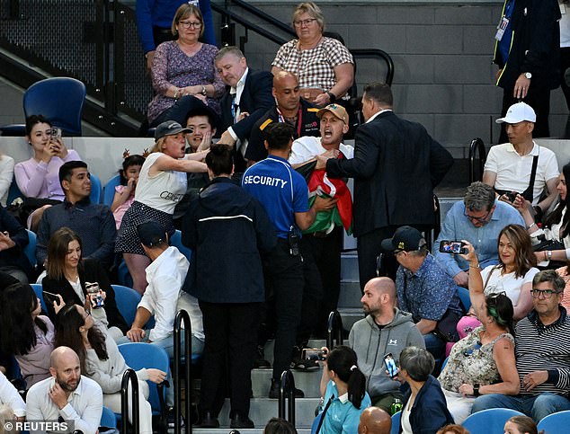 The demonstrators were removed by security to the sound of boos from throughout the stadium