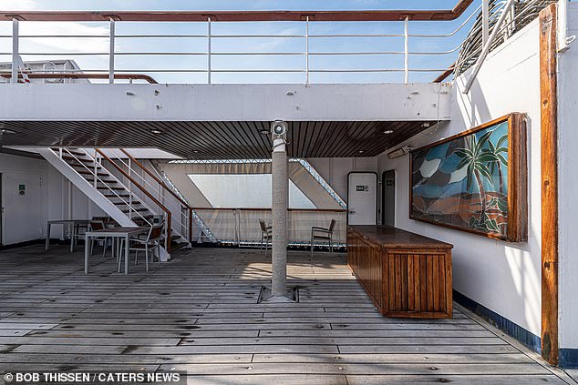 One deck of the ship still has picture frames hanging on the walls, despite being deserted