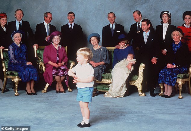 A photo taken at Prince Harry's christening at Windsor Castle on December 21, 1984. The royal family members appear amused by the antics of young Prince William.  Princess Anne was not among the guests.  She was in Gloucestershire shooting rabbits