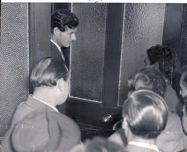 Group captain Peter Townsend, whose name is linked to that of Princess Margaret, is pictured talking to reporters outside the Lowndes Square house where he is staying in London.