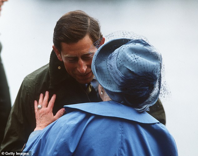 Prince Charles, Prince of Wales greets the Queen Mother with a kiss during their holiday at the Castle of Mey, her home on the Scottish coast